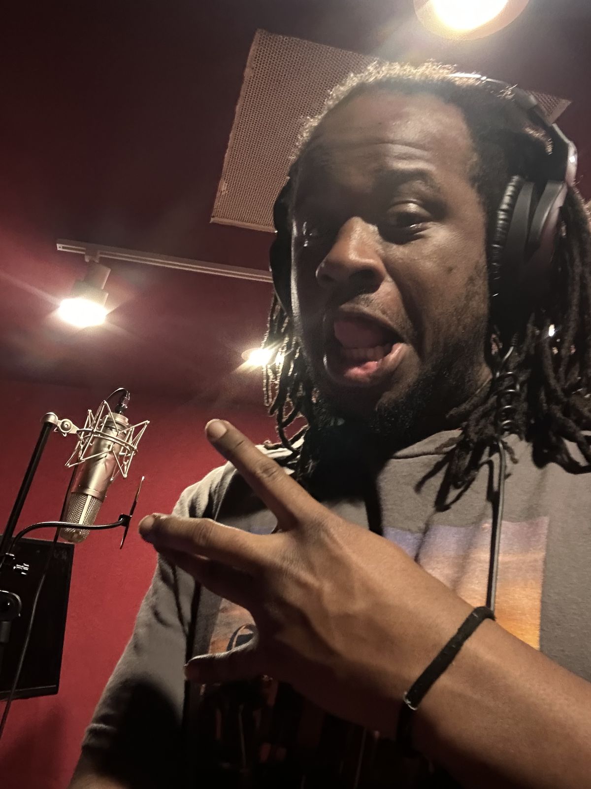 MT The Great mid-take at the mic in the recording booth